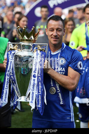 Chelsea's John Terry celebrates with the trophy after the Premier League match at Stamford Bridge, London. Stock Photo