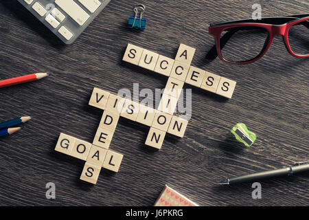 Success achieving business keywords collected of wooden cubes in Stock Photo
