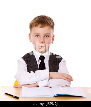schoolboy doing homework sitting isolated on white Stock Photo