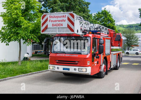 Iveco Magirus 160E30 turntable ladder truck of a Swiss fire brigade. Ladder and platform retracted. Stock Photo