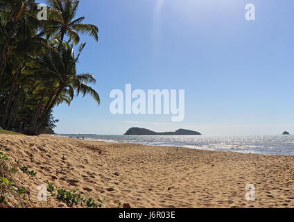 Palm Cove island views from the sand at the southern end of the esplanade beach stretch on a bright, sunny and beautiful late autumn day Stock Photo