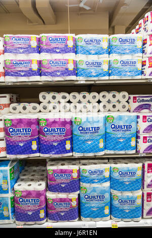 packages of Quilted Northern brand toilet paper stacked on grocery store shelves Stock Photo