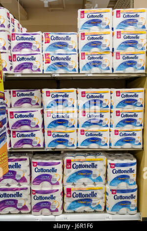 packages of Quilted Northern brand toilet paper stacked on grocery store shelves Stock Photo