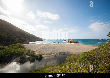 Amazing seascape of a turquoise sea in Italy. Beautiful wild beach of the Emerald coast in Sardinia. Stock Photo