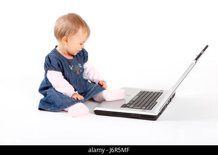 baby lax put sitting sit offhandedness layer casual youthful child computers Stock Photo