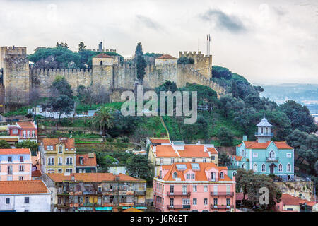 Lisbon is Portugal’s hilly, coastal capital city. From imposing São Jorge Castle, the view encompasses the old city’s pastel-colored buildings, Tagus Estuary and Ponte 25 de Abril suspension bridge. Stock Photo