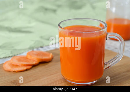 Fresh and delicious carrot juice in a glass Cup. Stock Photo