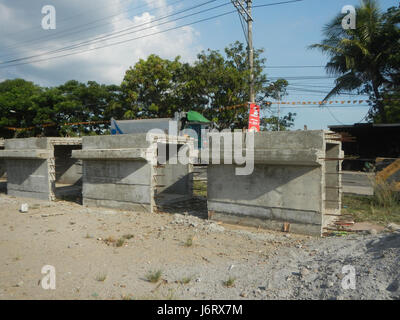 Photograph of landmarks along the construction site of the Tibag-Dulong Malabon-Pulilan road in Bulacan, Philippines, highlighting regional infrastructure development. Stock Photo