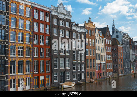 Traditional dutch old houses in center of Amsterdam, Netherlands, Europe. Typical historic buildings on canal in Amsterdam. Colorful facades of dutch  Stock Photo