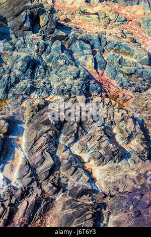 Stone bright multi-colored texture of natural rock Stock Photo