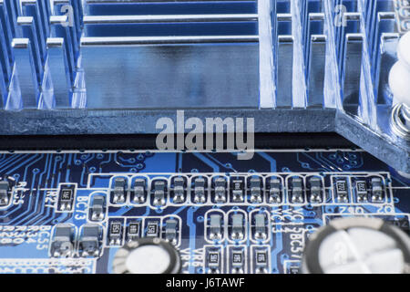 Radiator on chip of northbridge of computer motherboard close macro Stock Photo