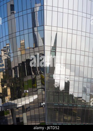 Flame towers skyscrapers in Baku Azerbaijan, a towering landmark of modern architecture, detail, reflected mosque and Caspian sea Stock Photo