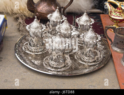 Traditional tea glasses on a tray with lids in a souvenir shop in Baku Azerbaijan Stock Photo