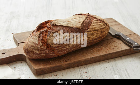 Fresh rye bread with knife Stock Photo