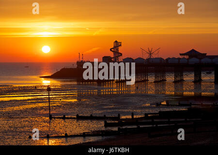 Herne Bay, Kent, UK. 22nd May 2017: UK Weather. Sunrise at Herne Bay pier at low tide. The coming week is set to see the highest temperatures this year with 27C predicted, and people are expected to head to the seaside helter skelter and amusements on Herne Bay seafront. Credit: Alan Payton/Alamy Live News Stock Photo