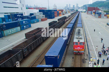 Shenzhen. 22nd May, 2017. Photo taken on May 22, 2017 shows the first freight train of China Railway Express from the city of Shenzhen to European countries at Yantian Port in Shenzhen, south China's Guangdong Province. Freight train X8428, with a total travelling length of 9900 kilometers and bound for Minsk of Belarus, departed from Shenzhen's Yantian Port on Monday, marking the opening of a new Sino-European freight train route starting from Shenzhen. Credit: Mao Siqian/Xinhua/Alamy Live News Stock Photo