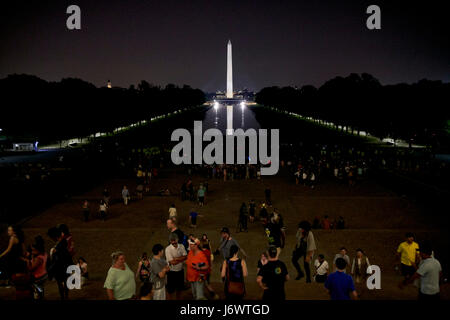 looking out of the lincoln memorial along the national mall and reflecting pool at night Washington DC USA Stock Photo