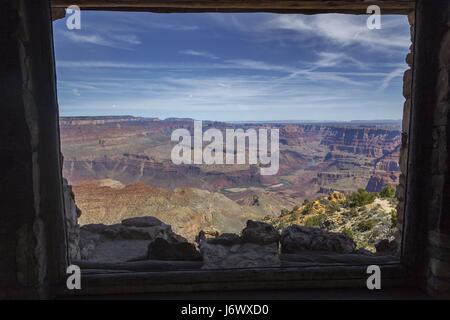 Grand Canyon of Colorado River in Arizona seen through the Window of Iconic Desert View Watchtower Stone Building on South Rim Stock Photo