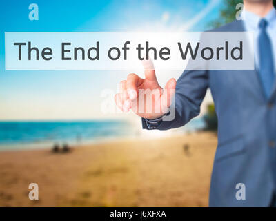 The End of the World - Businessman hand pressing button on touch screen interface. Business, technology, internet concept. Stock Photo Stock Photo