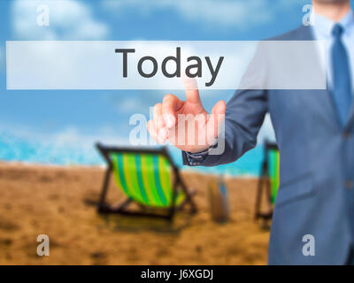 Today - Businessman click on virtual touchscreen. Business and IT concept. Stock Photo Stock Photo