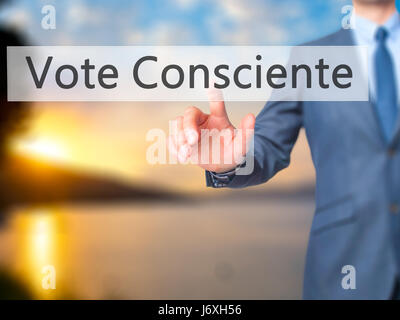 Vote Consciente - Businessman hand pressing button on touch screen interface. Business, technology, internet concept. Stock Photo Stock Photo