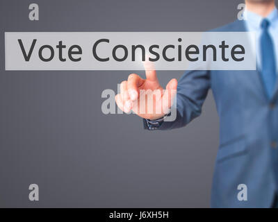 Vote Consciente - Businessman hand pressing button on touch screen interface. Business, technology, internet concept. Stock Photo Stock Photo