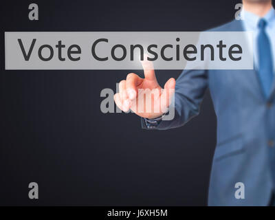 Vote Consciente - Businessman hand pressing button on touch screen interface. Business, technology, internet concept. Stock Photo Stock Photo