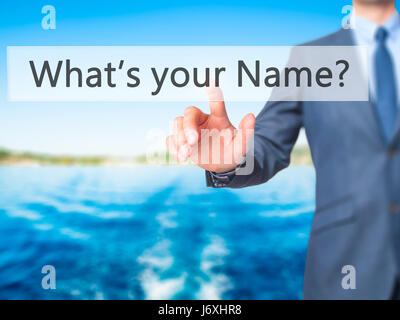 What's your Name - Businessman hand pressing button on touch screen interface. Business, technology, internet concept. Stock Photo Stock Photo