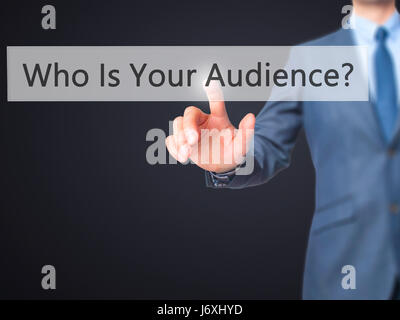 Who Is Your Audience? - Businessman hand pressing button on touch screen interface. Business, technology, internet concept. Stock Photo Stock Photo