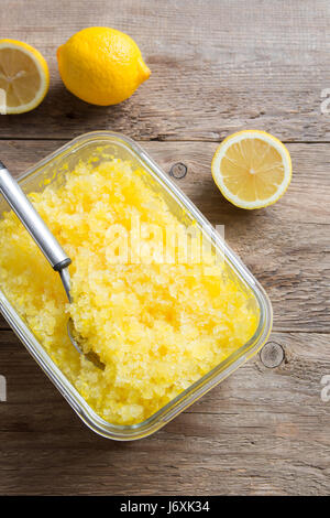 Lemon Frozen Granita Slush Drink on rustic wooden table. Homemade Italian Granita Dessert, refreshing  summer Slush Drink. Stock Photo