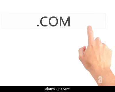 .COM - Hand pressing a button on blurred background concept . Business, technology, internet concept. Stock Photo Stock Photo