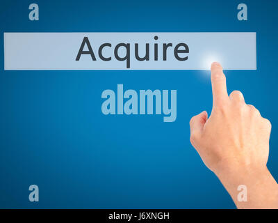 Acquire - Hand pressing a button on blurred background concept ...