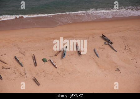 Aerial photograph of canoes, dugouts and fishing nets, midday, on a ferry flight from Monrovia to Freetown. Stock Photo