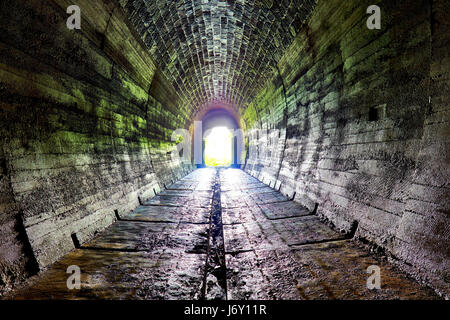Long underground brick tunnel Stock Photo