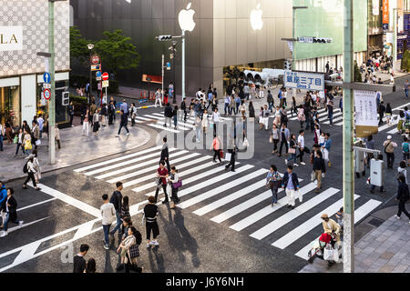 TOKYO - MAY 7, 2017: People wandering around the streets of Ginza, the luxurious shopping district in Tokyo, Japan capital city, where traffic is bann Stock Photo