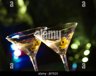 Two glasses with martini , focus on a olives Stock Photo