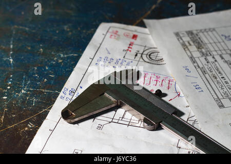 old vernier calipers on drawing plan with mini space Stock Photo