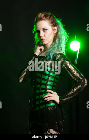 Fashion Woman in cosplay corset posing in studio Stock Photo