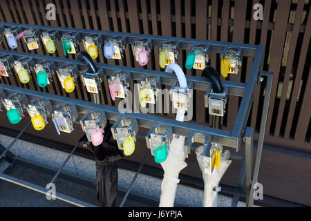 A rack outside a restaurant where you can lock your umbrella. Stock Photo
