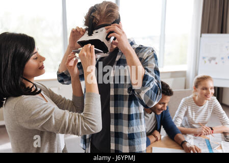 Nice handsome man wearing a virtual reality headset Stock Photo