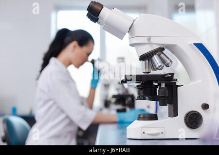 Close up of modern microscope standing on the table Stock Photo