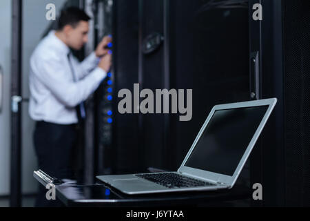 Selective focus of a laptop lying on the table Stock Photo