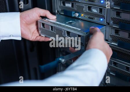 Blade server being in hands of a professional technician Stock Photo