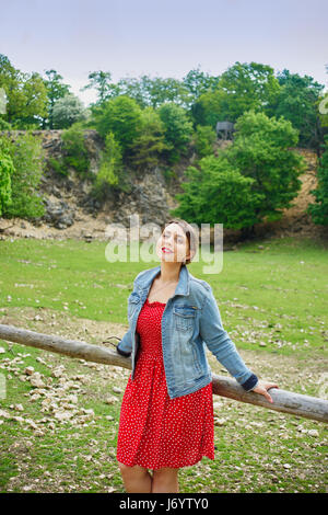 A young beautiful woman outdoors. Stock Photo