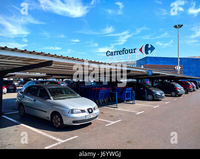 Torrevieja, Spain - March 17, 2017: Parking and facade of Carrefour hypermarket. Carrefour is a French multinational retailer, and one of the largest  Stock Photo