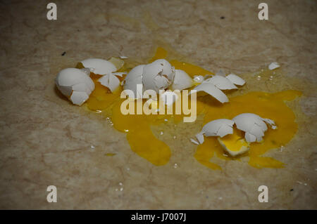 Broken Eggs on Floor Stock Photo