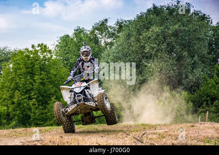 Uzhgorod, Ukraine - May 21, 2017:  ATV Rider in Dirt Bike Jumping action. TransCarpathian regional Motocross Championship Stock Photo