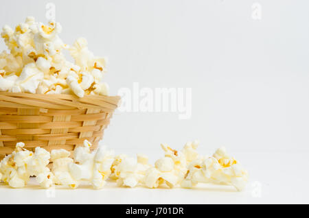 popcorn in basket  on white background Stock Photo
