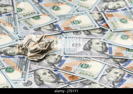 Crumpled bill against background of new money Stock Photo