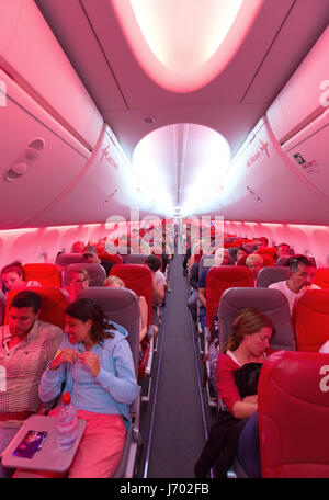 Aircraft passengers in the plane cabin of a Jet2 airline Boeing 737-800 aircraft flying from Lanzarote to the UK